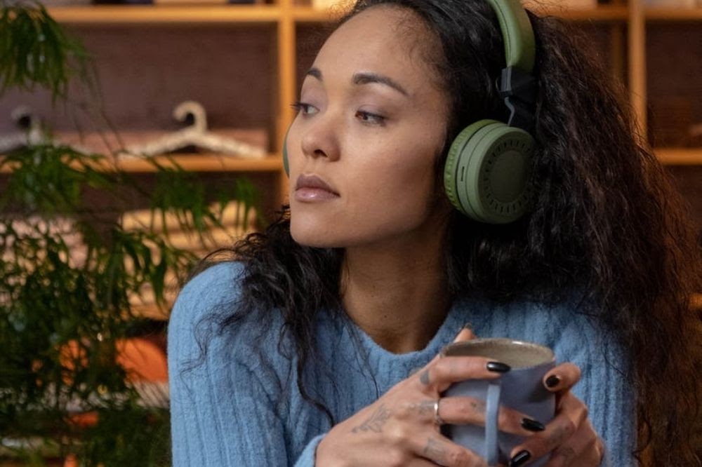 woman with headphones and coffee