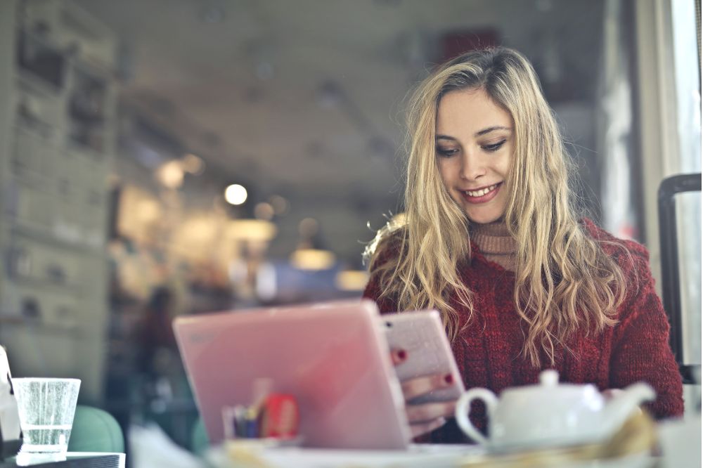 a woman cross promoting her podcast on her interview