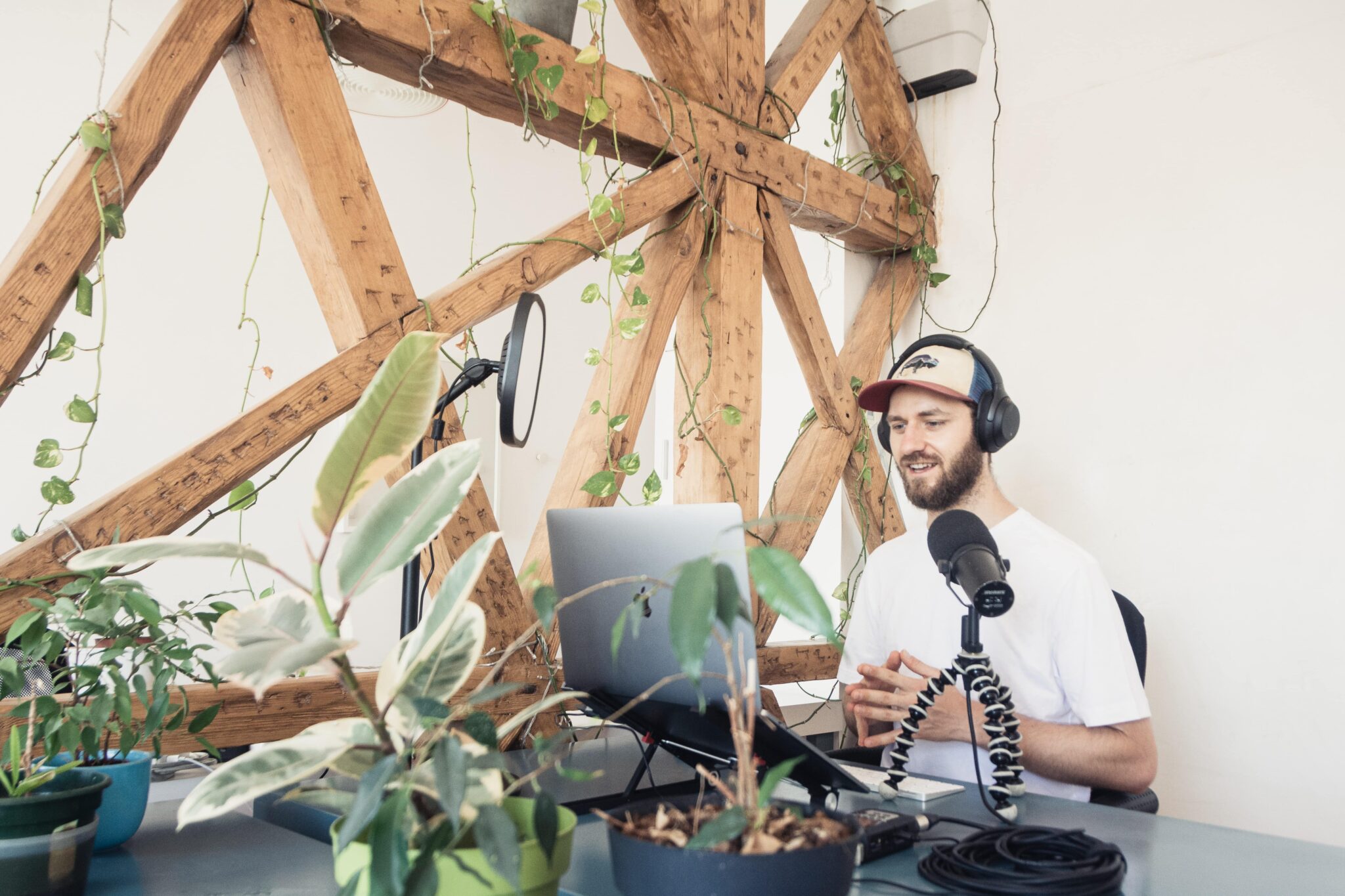 A content creator surrounded by plants