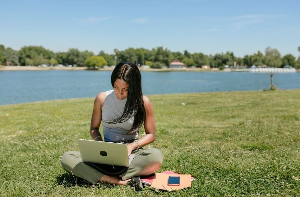 a woman working on her social media marketing efforts for podcast discoverability