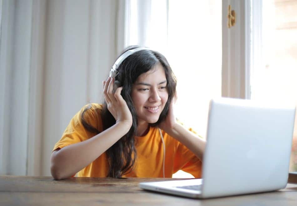 a new podcast listener enjoying the episode she's listening to