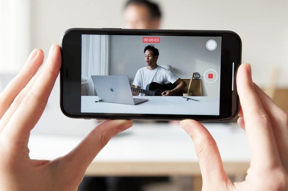 a man being video recorded with the sound effect to be added to enhance the edited video content