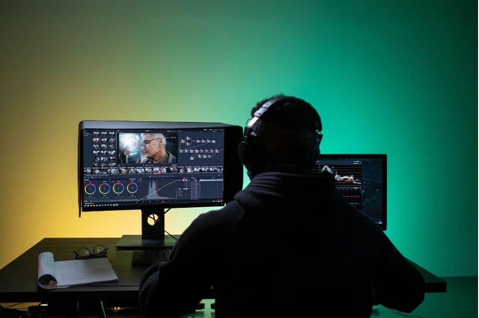 A man in the process of editing a video