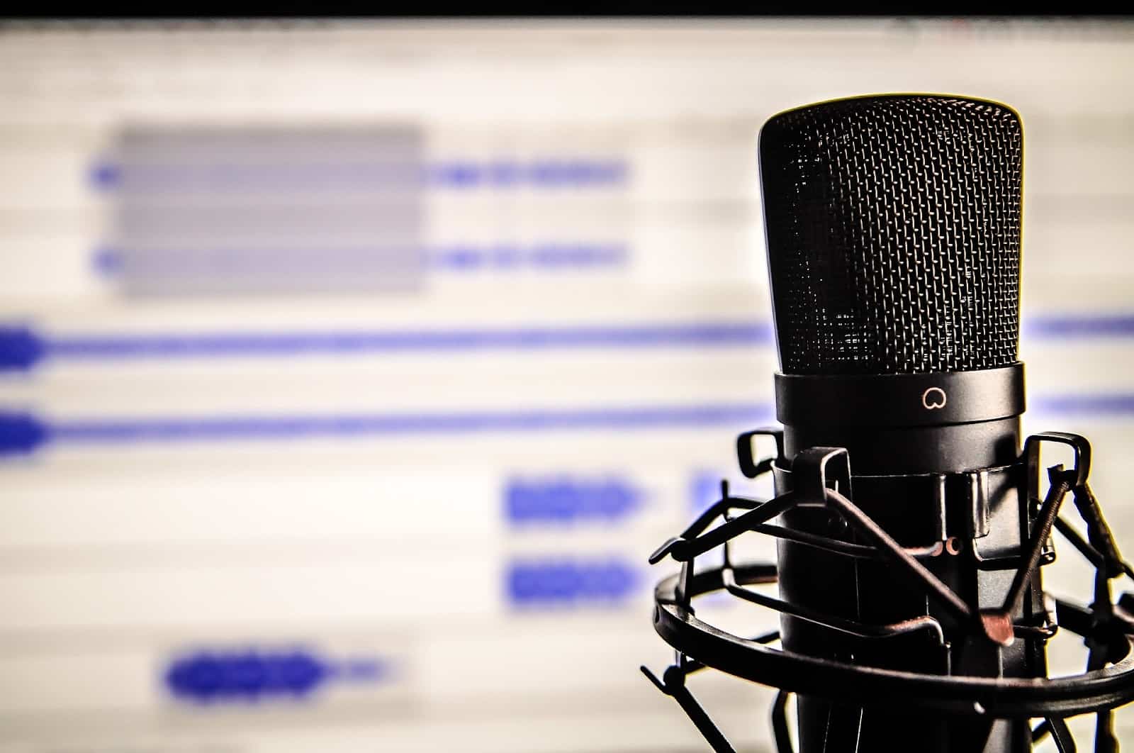 best audio editing software with cardioid mic in front of screen