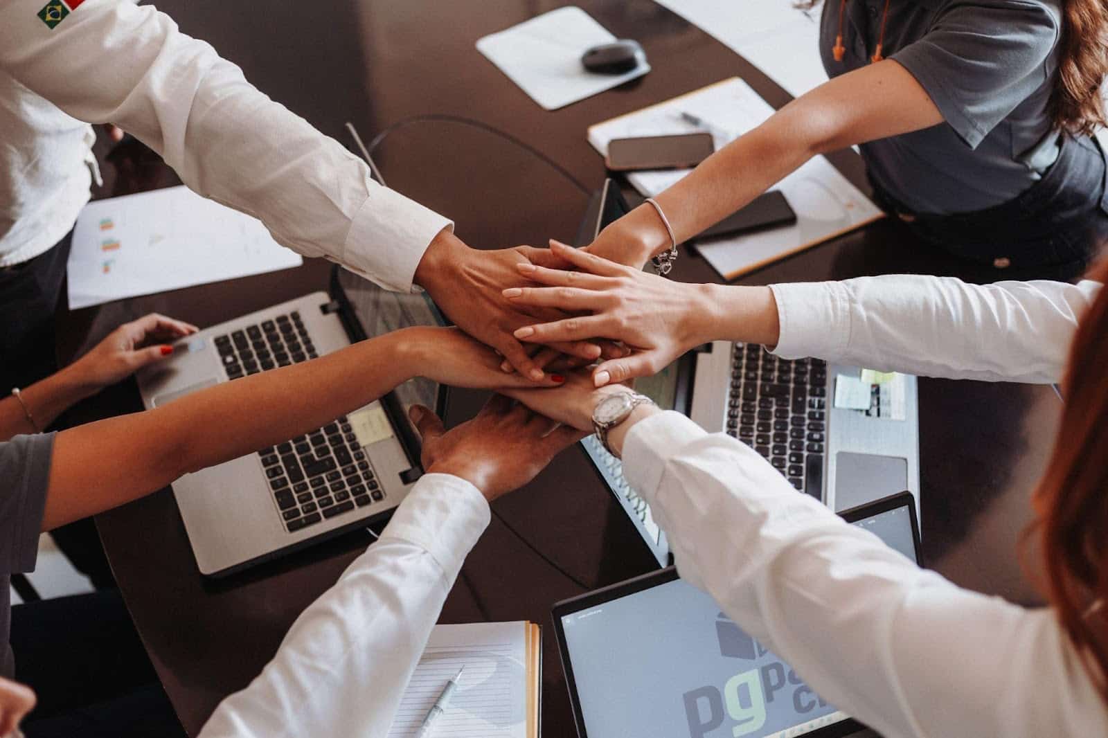 all hands together on a podcast team