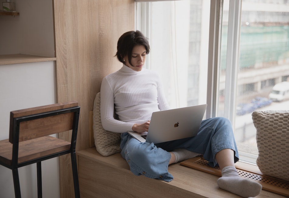 a woman using a software program on her Macbook to extract audio from video