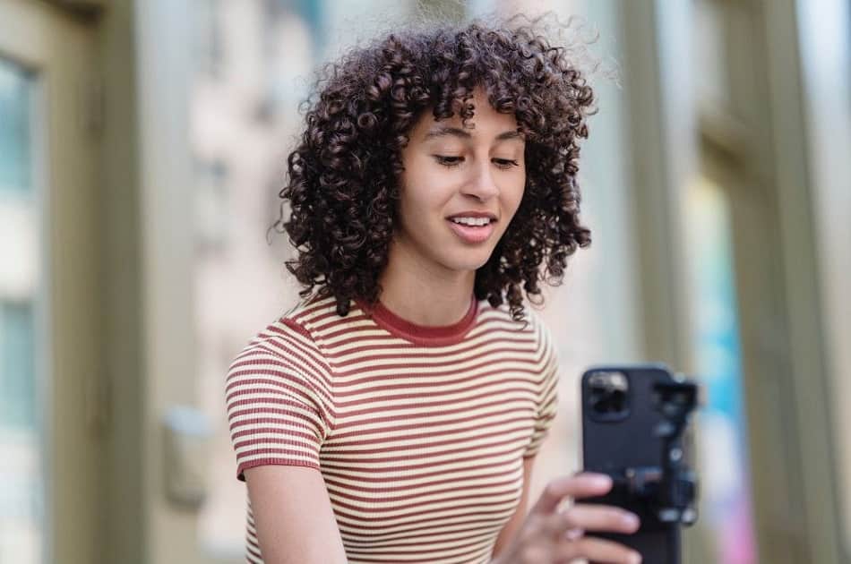 a woman recording a video as part of her podcast content materials for social media